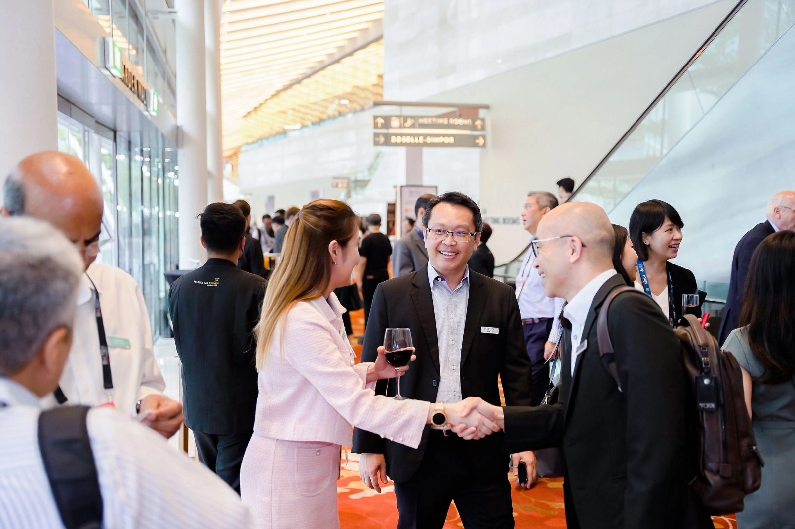 Delegates networking in the lobby of a Singapore convention venue